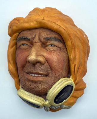 Painted chalkware wall hanging depicting an Arctic explorer