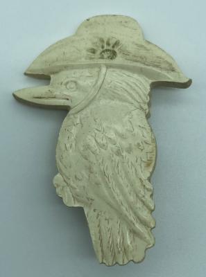 Moulded plastic brooch depicting a kookaburra wearing a slouch hat