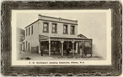 Black and white photographic postcard of ‘F. W. Bevilaqua’s Clothing Emporium, Albany, W.A.’ 
