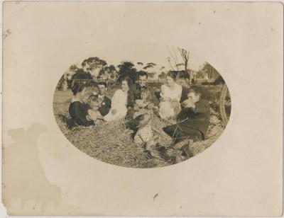 Family sitting in Hay at Charlie Wanke's Farm