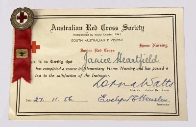 Australian Junior Red Cross certificate and badge awarded to Janice Heartfield