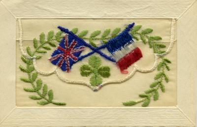 WWI silk postcard with flags and wreath