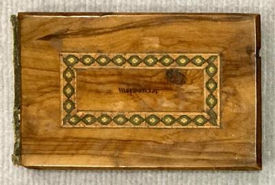 Front of souvenir olive wood album showing 'Jerusalem' upside down