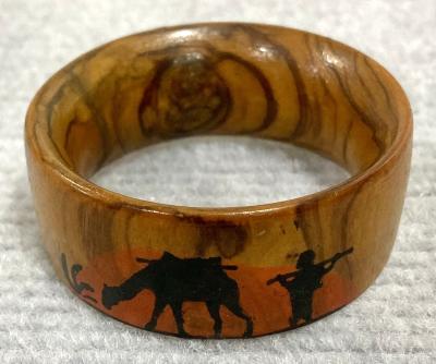 Front view of souvenir olive wood napkin ring from inside jewellery box