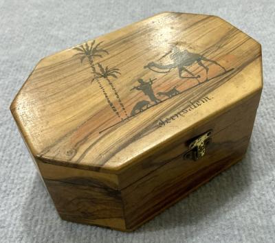 Oblique view of souvenir olive wood jewellery box from Jerusalem