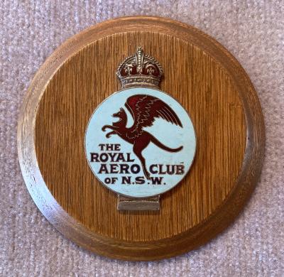 Royal Aero Club of N.S.W. car badge mounted on timber plaque