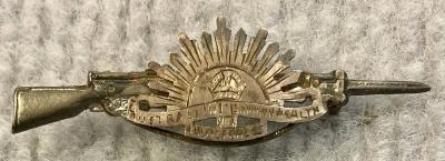 Sweetheart brooch with Rising Sun badge attached to rifle and bayonet