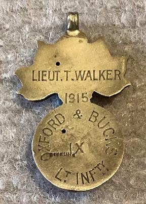 Sterling silver pendant or fob named to Lieutenant T. Walker, 1915