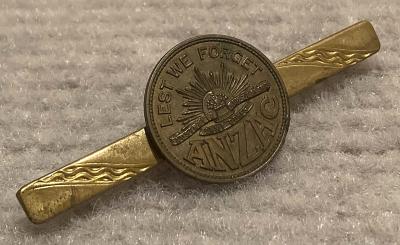 Angled view of 'Lest we forget ANZAC' tie or lapel pin