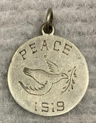 Silver Peace medallion featuring dove carrying olive branch - 1919