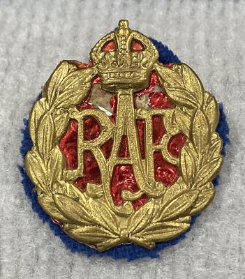 Royal Air Force cap badge with paper and cloth backing