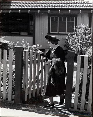 Elsie Curtin at the front gate of her house
