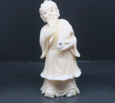 SCRIMSHAW FIGURINE with fish
