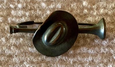 Metal slouch hat mounted on bugle sweetheart brooch