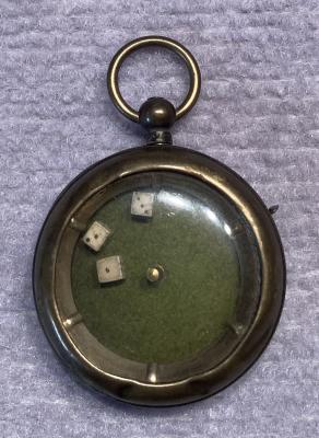 Mechanical dice game encased in a pocket watch housing