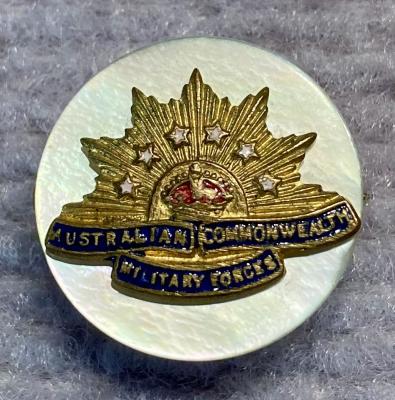 Miniature Rising Sun badge brooch with mother of pearl backing