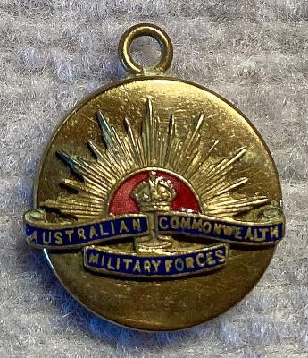 Gold tone metal and enamel Rising Sun badge sweetheart pendant locket 