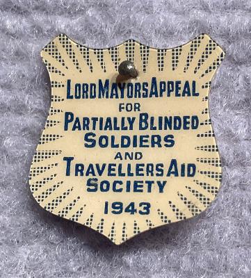 'Lord Mayors Appeal for Partially Blinded Soldiers and Travellers Aid Society 1943' celluloid fundraising pin 
