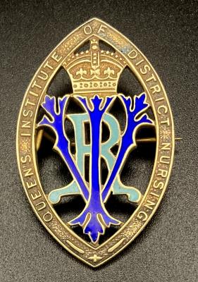 Queen's Institute of District Nursing badge presented to Winifred L. Bingham