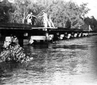 Railway Bridge during flood - Mrs Badrick & Kelva watching water