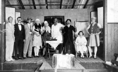 Nannup Concert Party C.1934. White Suit - J Rydings. Moustache and dinner suit - Roy Rowe. Beard and Stick - Fred Clayton. Seated - Mrs. Peaken.