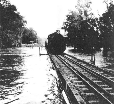 Train on flooded Railway Bridge