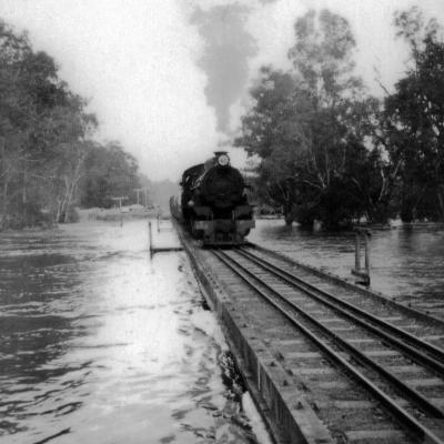 Train on flooded Railway Bridge