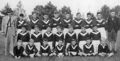 Nannup School Boys Football Team. C.1940  Back row on right, second from the end: Lindsay Cole. At end: Dennis Russell. 