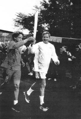 Sydney Olympic Games 2000.  Torch around Australia.  July 1999 in Nannup. Left:Tyson Lee - torch bearer.