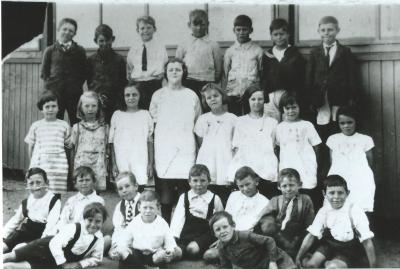 Black and White photograph Back Row :  Jim Campbell, Stanley Garwood, Bert Bandy, Walter Garwood, Alby Lowe, Ken Alphick, Frank Gough 2nd Row :  Jessie Leopold, Shirley Prowse, Dulcie Noack, Evelyn Taylor, Dorothy Taylor, Joyce Dyer, Vida Windsor, Kath...