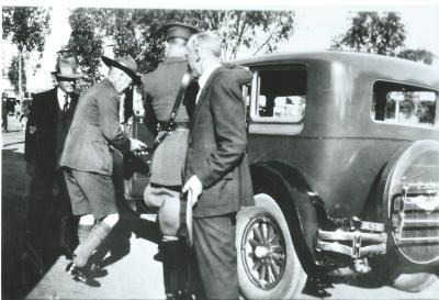 Black and White photograph.  Governor Sir William Campion opens Scout Hall. Walter Stevens' Dodge Sedan in photo