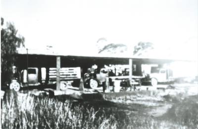 Black and White photograph Electweld Steel co trucks being fitted with gas producers