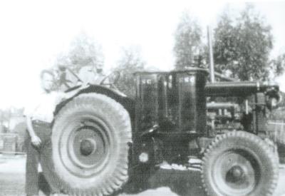 Black and White photograph Kellerberrin Electweld Steel. Jack Mather with W40 McCormack tractor and gas producer for Ryan Bros, Tammin