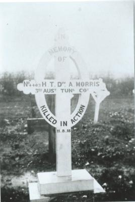 Black and White photograph.  Military Head Stone "In memory of No 4403 HTDrv A Morris 3rd August Tunl Coy Killed in Action 11 August 1918