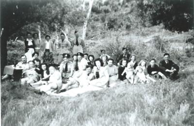 Black and White photograph Group of people having picnic - including soldiers WWII