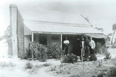 Black and White photograph.  Methodist Manse pre 1910.  Reverand Harley Morrell at right