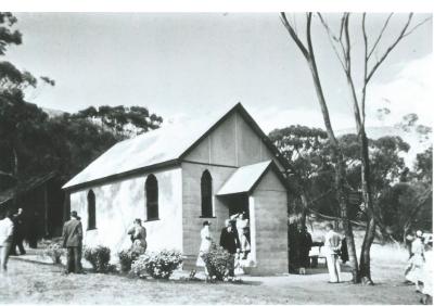 Black and white photograph.  Mt Stirling Presbyterian Church dedication 1955.  Old bush church in background