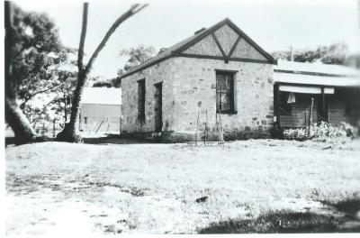 Black and White photograph.  Stone House