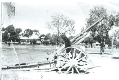 Black and White photograph.  Kellerberrin Junior High School 1955.  Field Gun 1914 -18 war donated to school and displayed in Henley Park