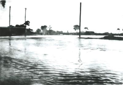 Black and White photograph.  Flooding at Kellerberrin Hotel Corner.  Ripper St/ Massingham Street Kellerberrin