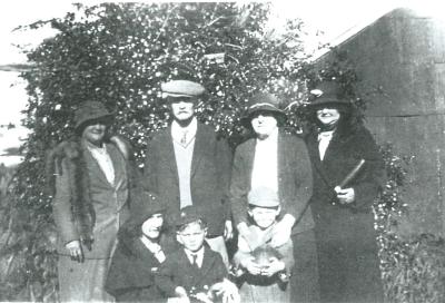 Black and White photograph.  Mr and Mrs George, Nita and boys and visitors