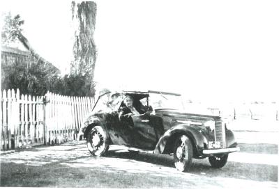 Black and White photograph.  Mrs George of Doodlakine with her new Austin Coupe 1947 - sold by Barney Thornton - Kellerberrin