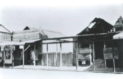 Black and White photograph.  Puddey's  store after the fire.