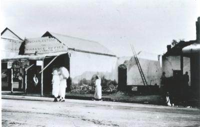 Black and White photograph.  Puddey's store demolition in progress after fire
