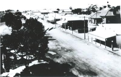 Black and White photograph.  Massingham Street, Kellerberrin. View from Railway Water Tank.  Post Office, Co-op in photograph