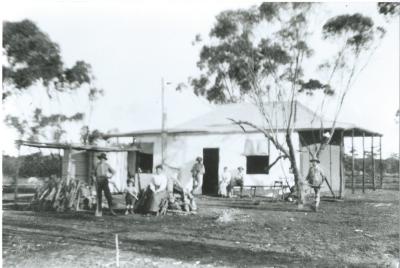 Black and White photograph.  W N Laird farm house and family