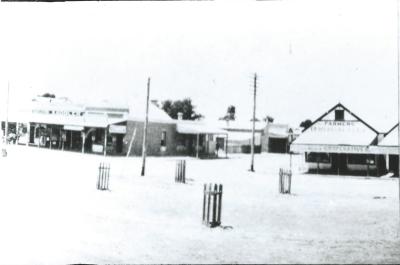 Black and White photograph.  Massingham Coop on corner of Sewell St and Massingham Street