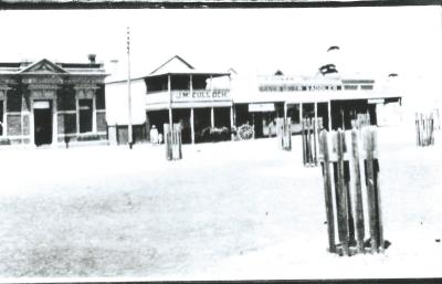 Black and White photograph.  National Bank of Australia, J McCulloch, Cash Store, Saddler.  Massingham St Kellerberrin