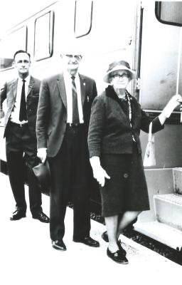 Black and White photograph.  First prospector train. L-R S M Cowan, Fred and Essie Nicholls