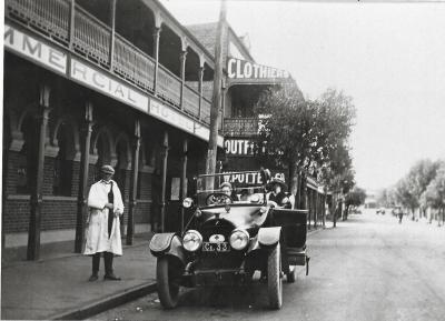 Black and White photograph.  Thomas Ockerby and family in Cadillac outside Commercial Hotel in Merredin